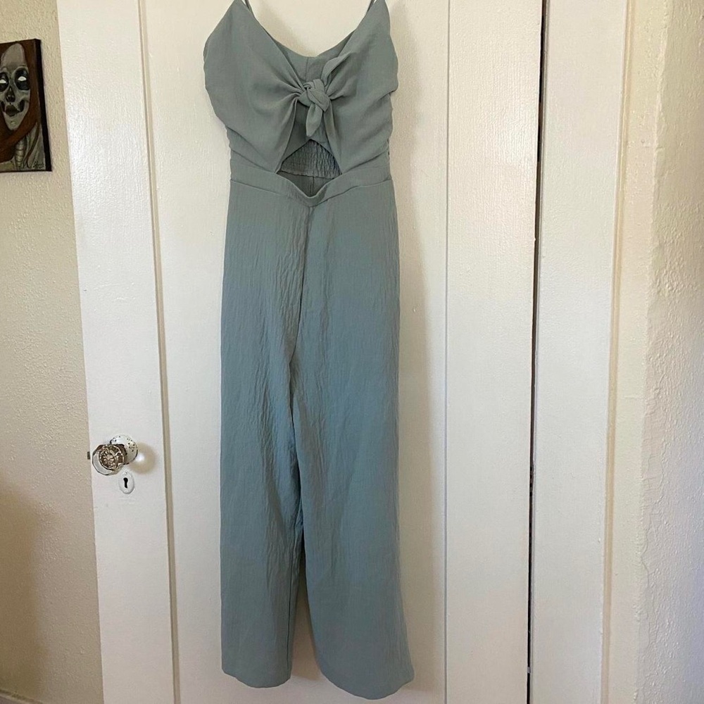 Size small pastel blue romper, tie front, side zipper, adjustable straps